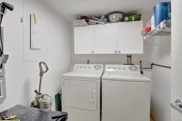 laundry room featuring cabinets and separate washer and dryer