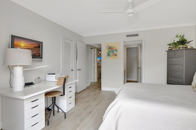 bedroom with ceiling fan, light hardwood / wood-style floors, and ornamental molding