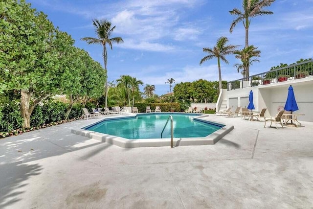 view of swimming pool with a patio