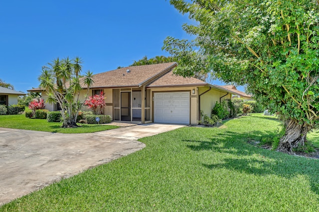 single story home with a garage and a front yard