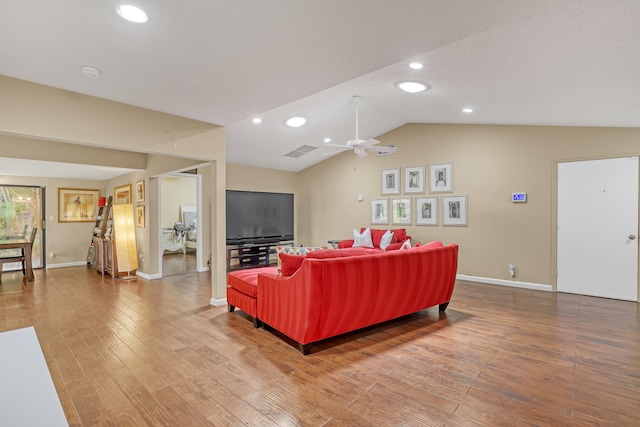 living room with wood-type flooring, lofted ceiling, and ceiling fan