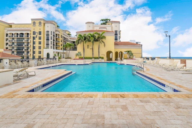 view of swimming pool featuring a patio area