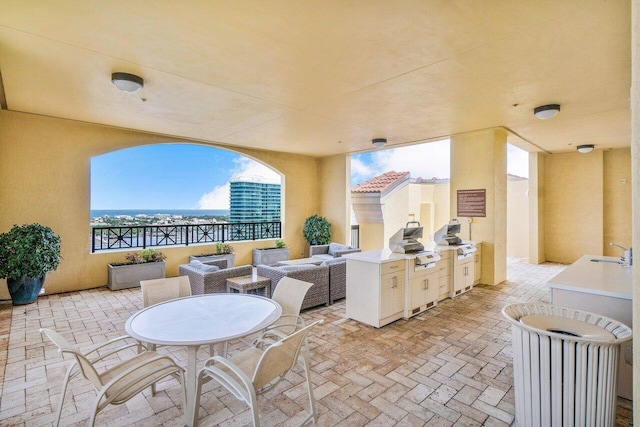 view of patio featuring sink and grilling area