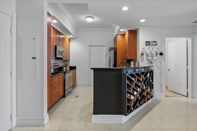 kitchen featuring stainless steel appliances, sink, light tile flooring, and crown molding