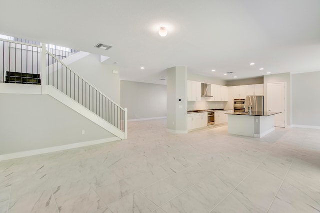 unfurnished living room with light tile floors