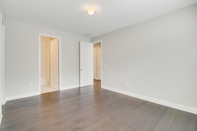 empty room featuring dark hardwood / wood-style floors