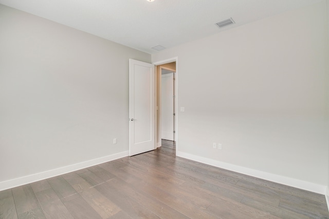 unfurnished room featuring hardwood / wood-style floors