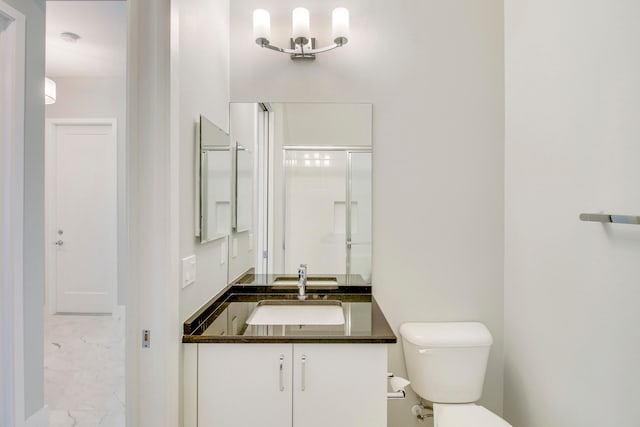 bathroom featuring tile floors, vanity, and toilet