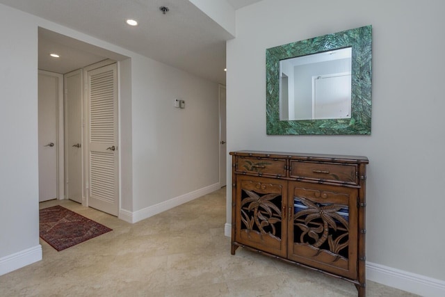 hallway with light tile floors