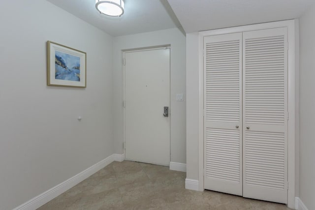 unfurnished bedroom featuring light tile flooring