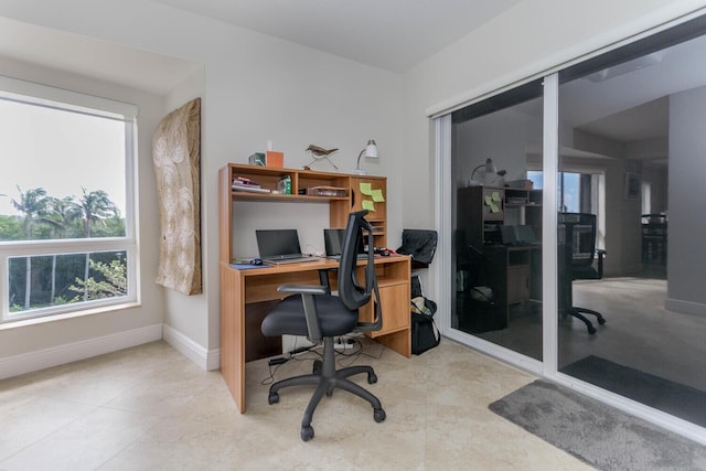 home office with light tile flooring