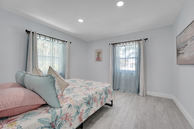 bedroom with light hardwood / wood-style floors