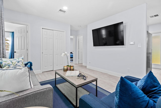 living room with light hardwood / wood-style floors