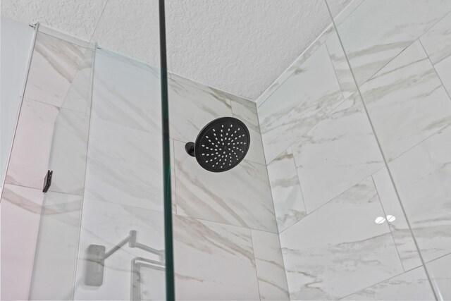 details with a tile shower