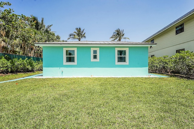 view of side of property featuring a yard