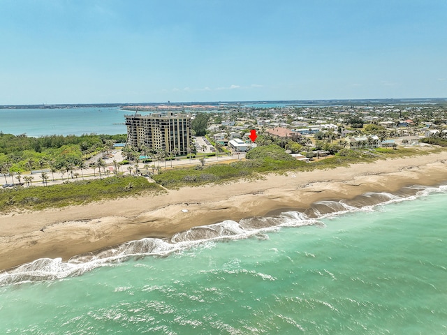 drone / aerial view with a view of the beach and a water view