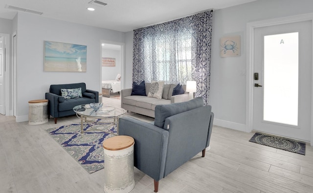 living room with light hardwood / wood-style floors