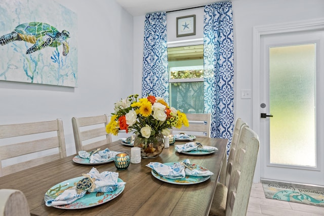 dining area with light hardwood / wood-style floors