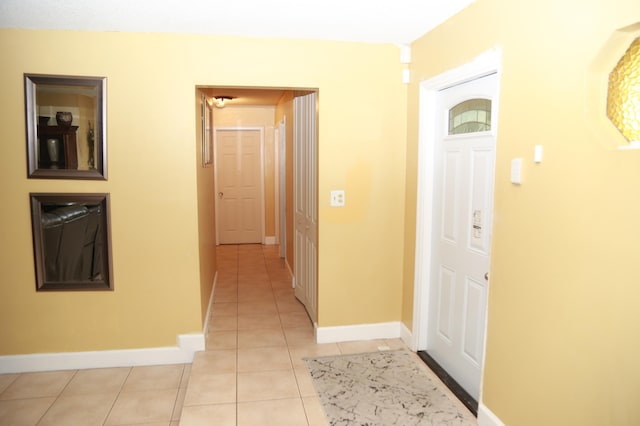 foyer entrance featuring light tile floors