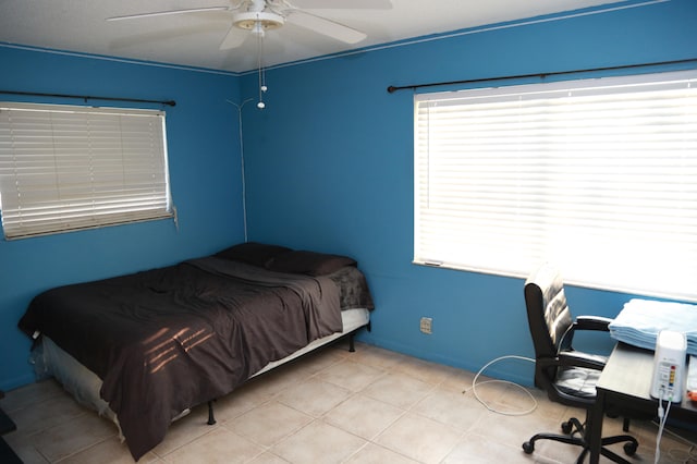 tiled bedroom with ceiling fan