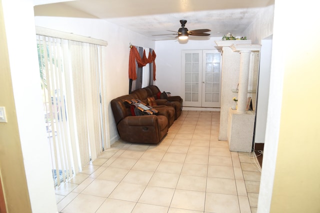 sitting room with french doors, ceiling fan, and light tile flooring