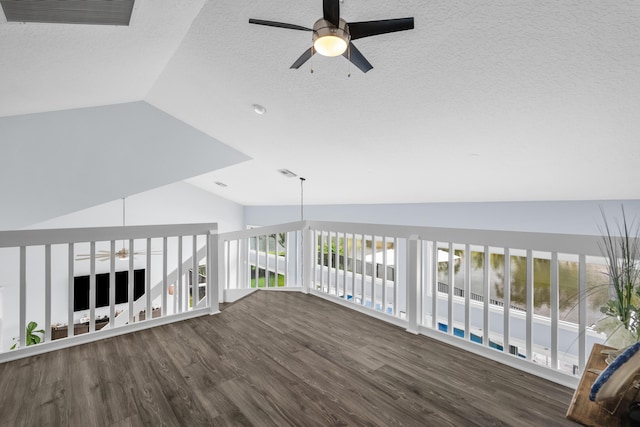 9029 SE Breeze Way, Hobe Sound, FL 33455 - interior space featuring ceiling fan, lofted ceiling, visible vents, and wood finished floors
