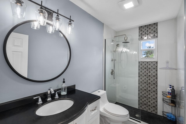 bathroom featuring toilet, an enclosed shower, and vanity