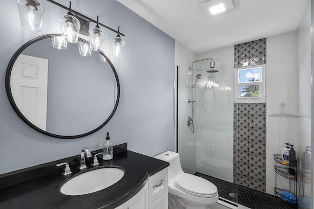 9029 SE Breeze Way, Hobe Sound, FL 33455 - bathroom with a tile shower, vanity, and toilet
