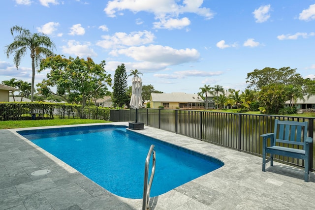 9029 SE Breeze Way, Hobe Sound, FL 33455 - view of pool with a patio, a fenced in pool, and a fenced backyard