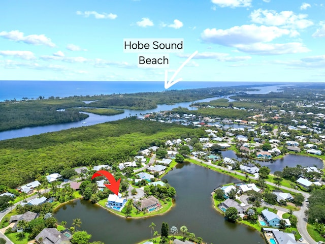 9029 SE Breeze Way, Hobe Sound, FL 33455 - drone / aerial view featuring a water view and a residential view