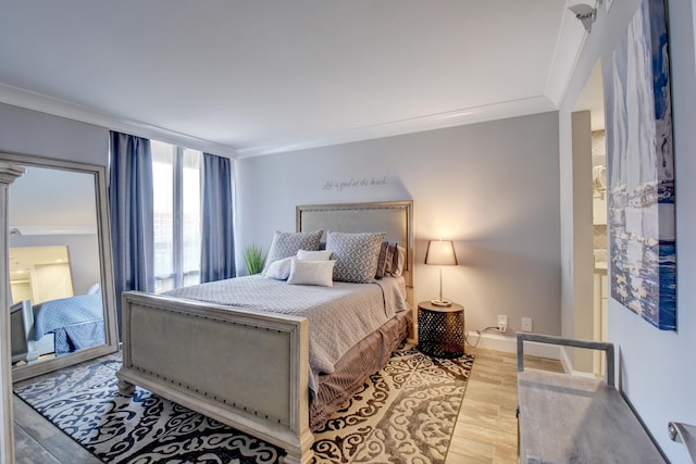 bedroom featuring hardwood / wood-style flooring and crown molding