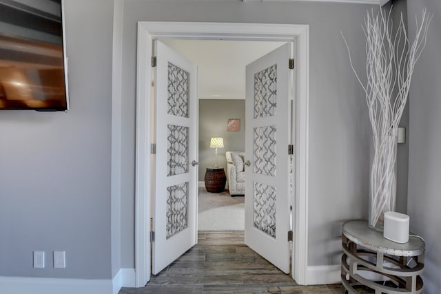 corridor with wood-type flooring