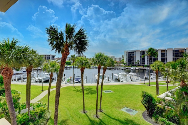 view of nearby features featuring a yard and a water view