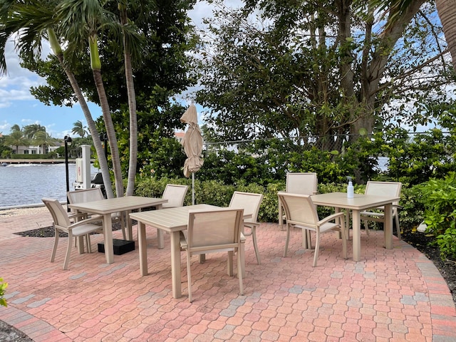 view of patio with a water view