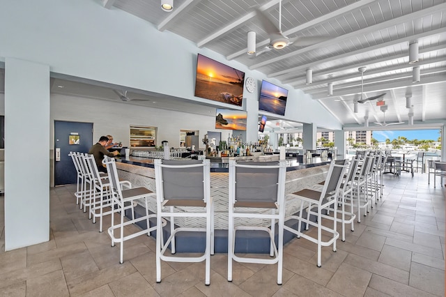 interior space featuring ceiling fan and light tile flooring