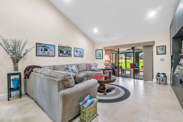 living room with high vaulted ceiling, ceiling fan, and light tile floors