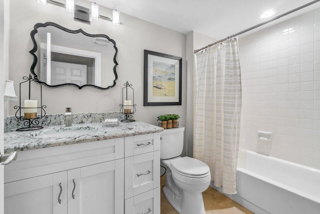 full bathroom featuring vanity, toilet, and shower / tub combo