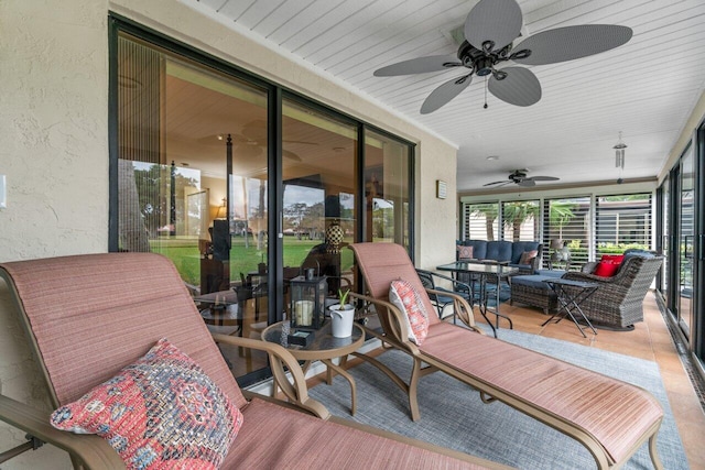 sunroom / solarium with ceiling fan