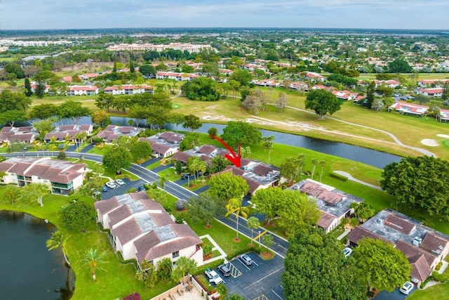 drone / aerial view with a water view