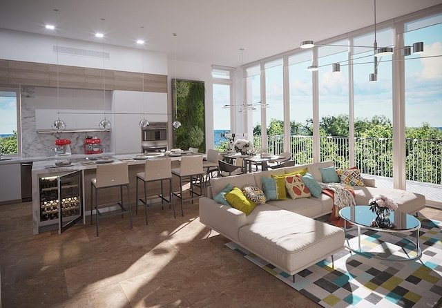 living room featuring tile flooring, wine cooler, and a wealth of natural light