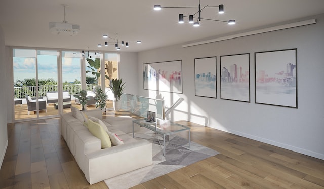 living room with wood-type flooring and a notable chandelier