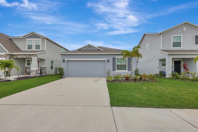 view of front of home with a garage and a front yard