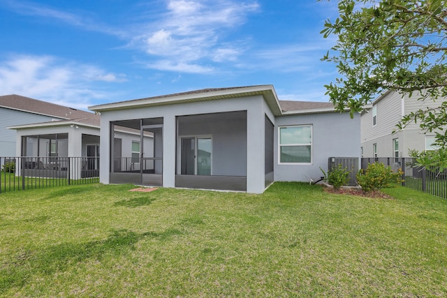 rear view of house with a yard