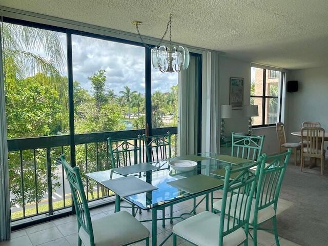 sunroom with a notable chandelier