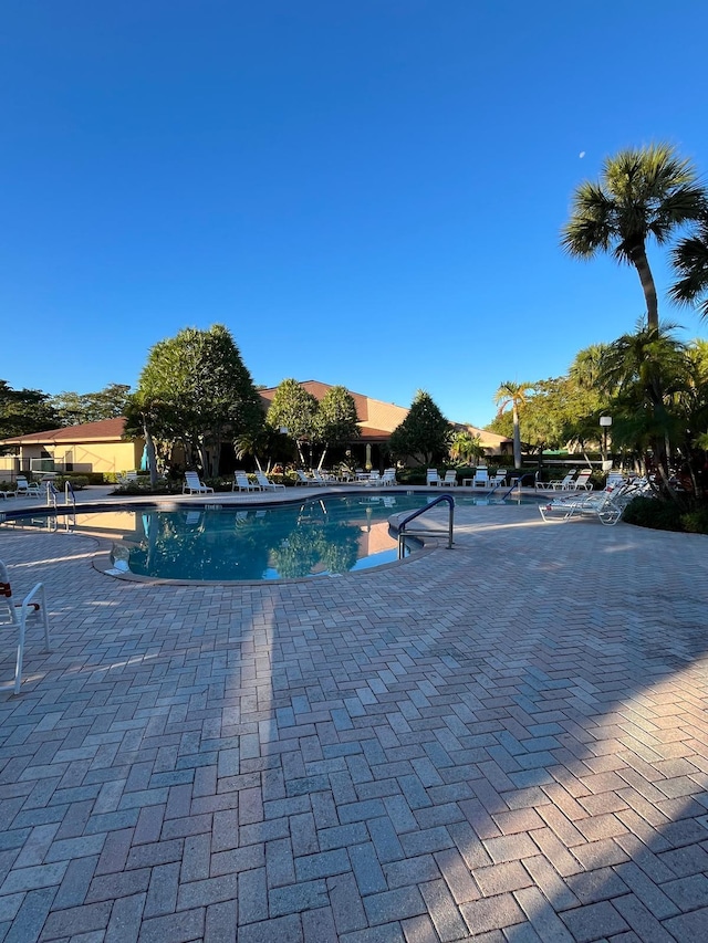 view of swimming pool featuring a patio