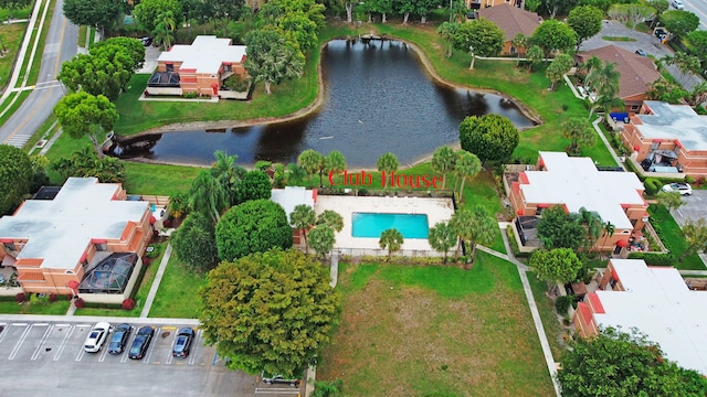 birds eye view of property with a water view