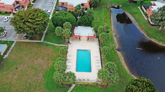 birds eye view of property with a water view