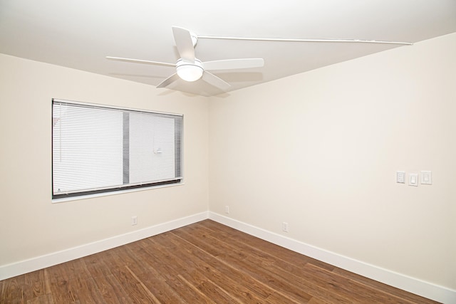 unfurnished room with ceiling fan and dark hardwood / wood-style floors