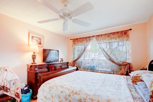 bedroom featuring a textured ceiling and ceiling fan