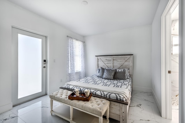 bedroom with marble finish floor and baseboards